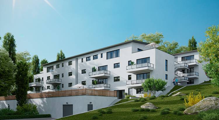 Alt-Text: „Modernes Wohngebäude mit energieeffizienter Fassade und integrierten Balkonen, umgeben von grüner Landschaft, symbolisiert nachhaltige Bauweise und zeitgemäße Gebäudetechniklösungen.“.