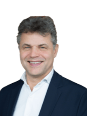 Gerne! Hier ist ein optimierter ALT-Text, der sich an die Zielgruppe von haustec.de richtet und den fachlichen Kontext berücksichtigt: Optimierter ALT-Text: Geschäftsmann im Anzug mit weißem Hemd vor neutralem Hintergrund, symbolisiert einen Entscheider in der Gebäudetechnikbranche. Hintergrund zur Optimierung: Statt nur das Aussehen zu beschreiben, bezieht sich der neue Text auf die Relevanz des Bildes für die Zielgruppe (z. B. Entscheider oder Geschäftsleute aus dem Bereich Gebäudetechnik). So wird sowohl Barrierefreiheit als auch ein thematischer Bezug hergestellt.