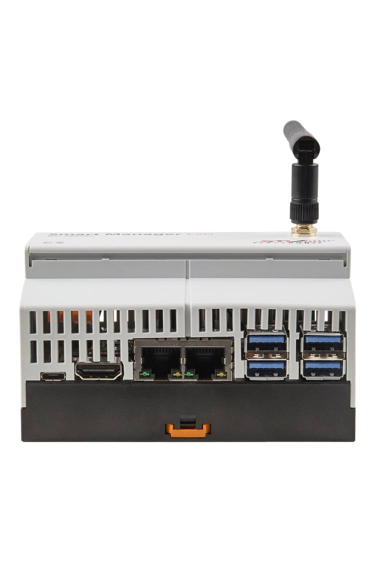 Kompaktes graues IoT-Gateway mit mehreren USB-, Ethernet- und HDMI-Anschlüssen sowie externer Antenne für den industriellen Gebäudeeinsatz.