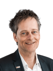 Fachplaner Gebäudetechnik mit dunklem Haar und Anzug, Porträtaufnahme, geeignet für B2B-Themen wie TGA, Energieeffizienz oder SHK auf haustec.de.