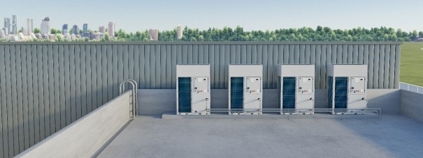 Fünf große Klimageräte auf einem Flachdach, im Hintergrund Stadtansicht und Bäume - Beispiel moderner Gebäudetechnik für energieeffiziente TGA.