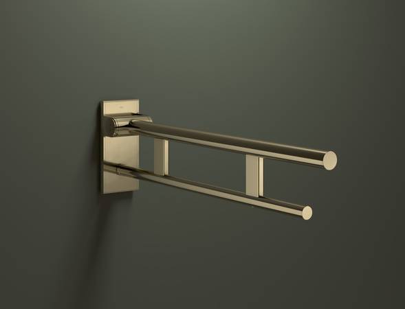 Edle Anmutung im barrierefreien Sanitärraum. Der bewährte Stützklappgriff in Messing glänzend bringt Wärme und Wohnlichkeit in Badezimmer.  Edle Anmutung im barrierefreien Sanitärraum. Der bewährte Stützklappgriff in Messing glänzend bringt Wärme und Wohnlichkeit in Badezimmer.