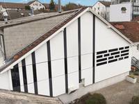 Solarthermie: Streifenkollektoren an der Hausfassade